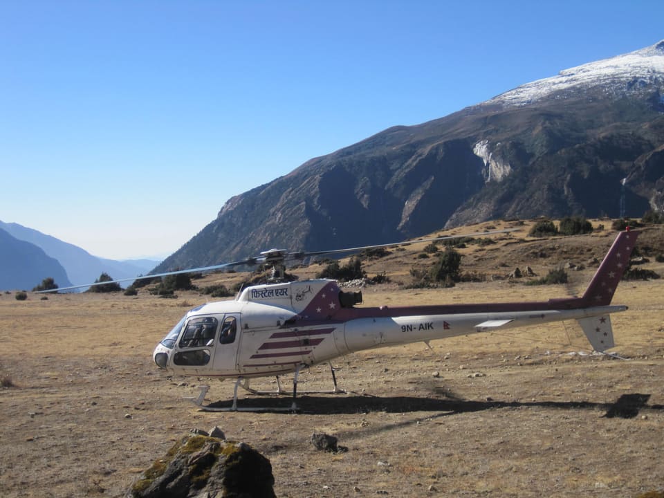 A helicopter waiting on the high airstrip at Syangboche in the Everest region